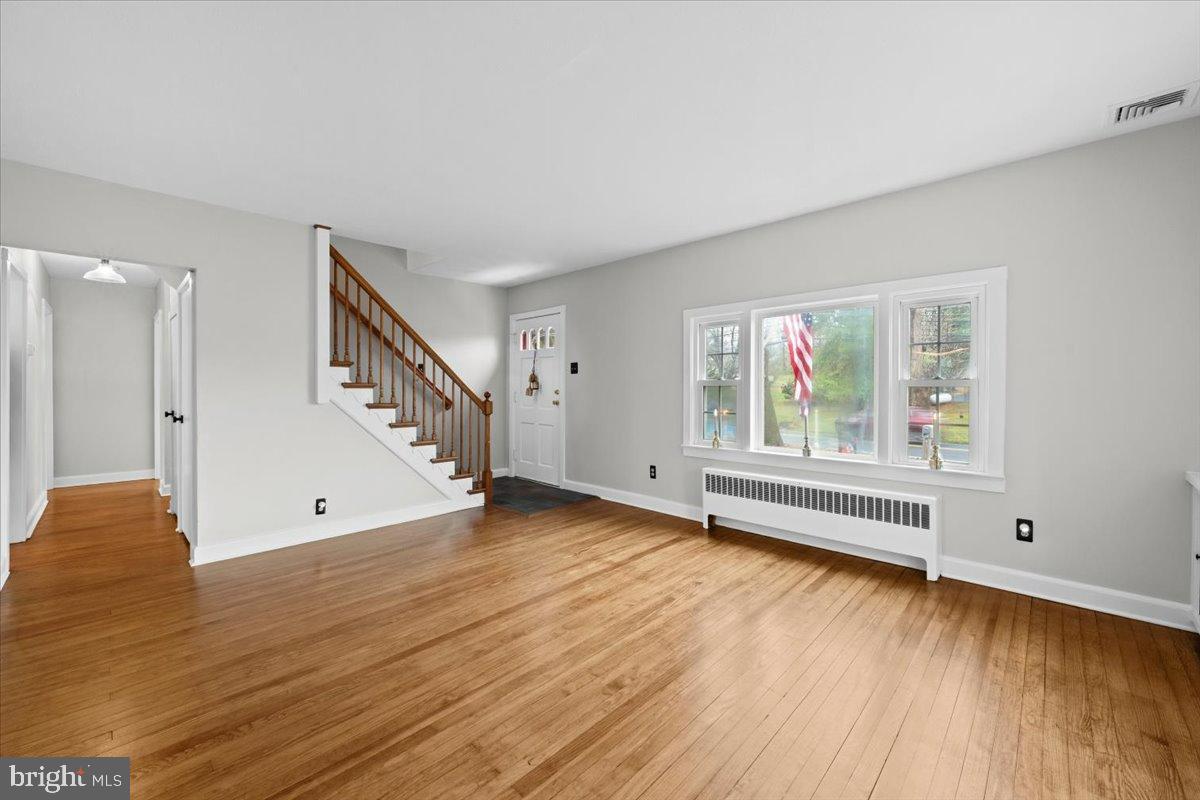 3349 Brodhead Road Bethlehem, PA 18020 - Photo 17 of 53 a view of an empty room with wooden floor and a window