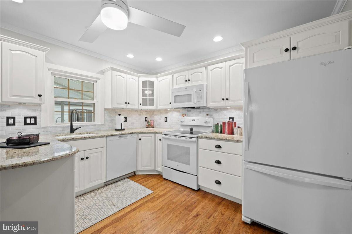 3349 Brodhead Road Bethlehem, PA 18020 - Photo 29 of 53 a kitchen with white cabinets stainless steel appliances and wooden floor