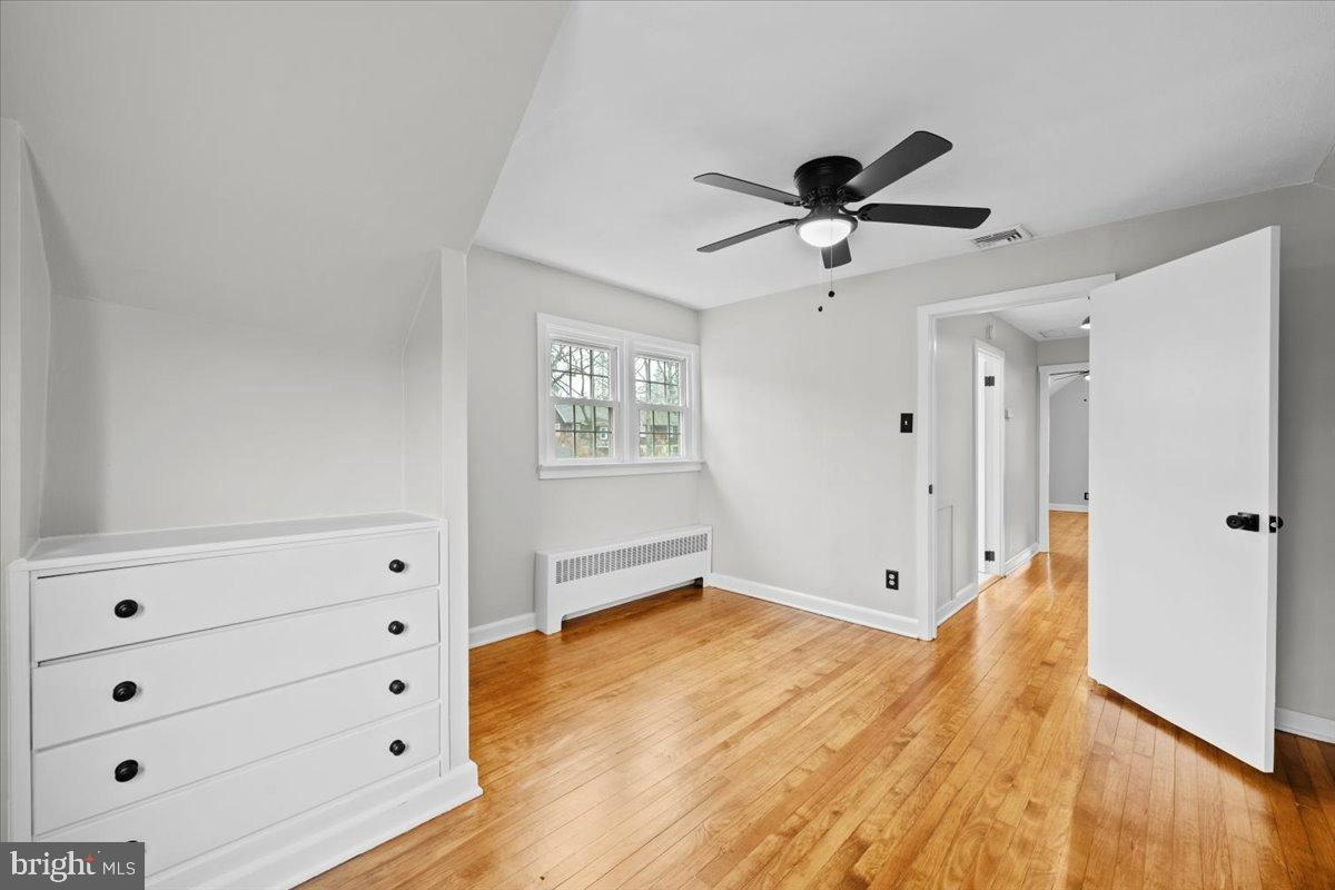 3349 Brodhead Road Bethlehem, PA 18020 - Photo 40 of 53 a view of a livingroom with wooden floor and a ceiling fan