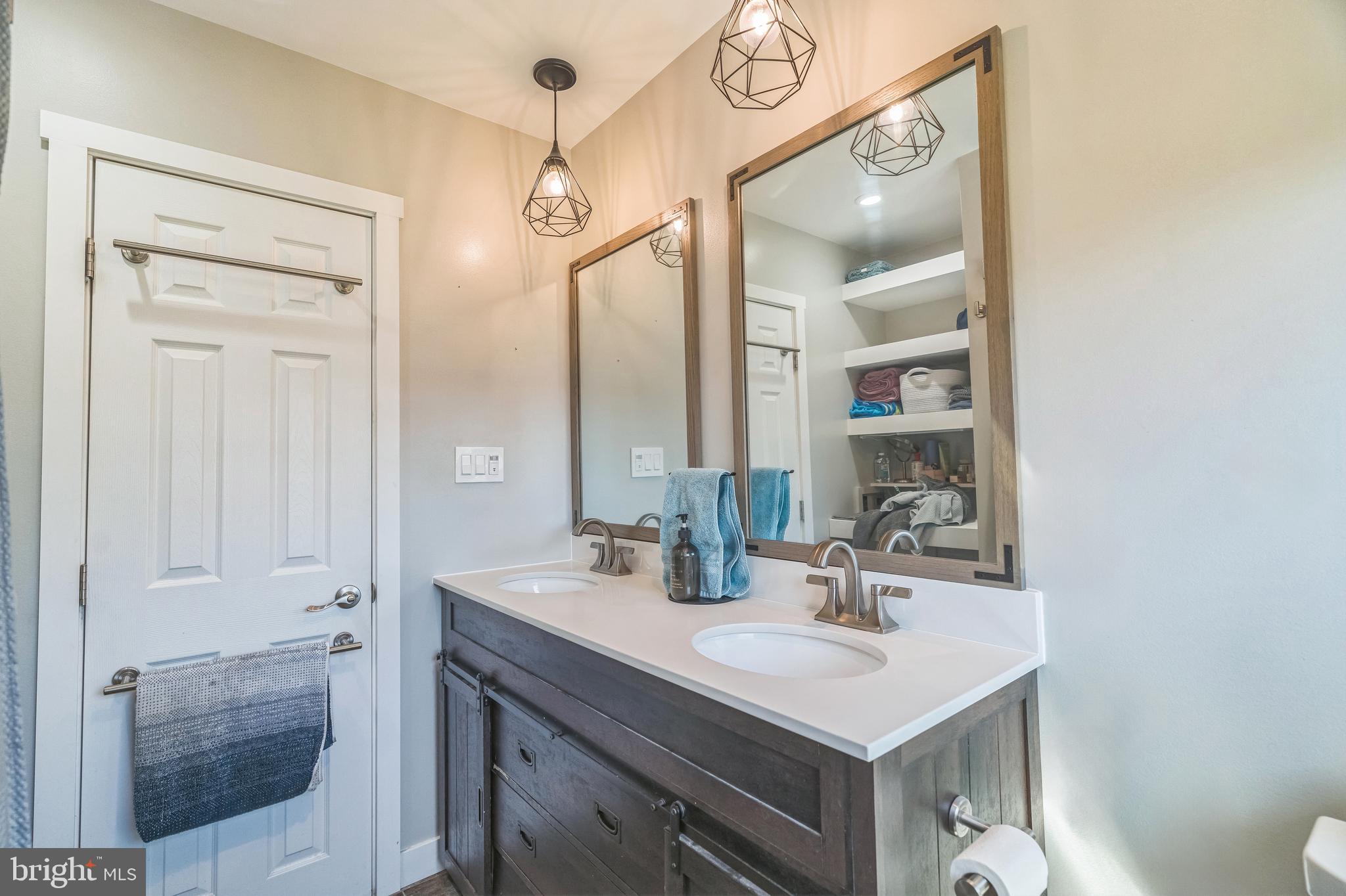 17 Gladwyn Road Marlton, NJ 08053 - Photo 23 of 34 a bathroom with a sink vanity and a mirror