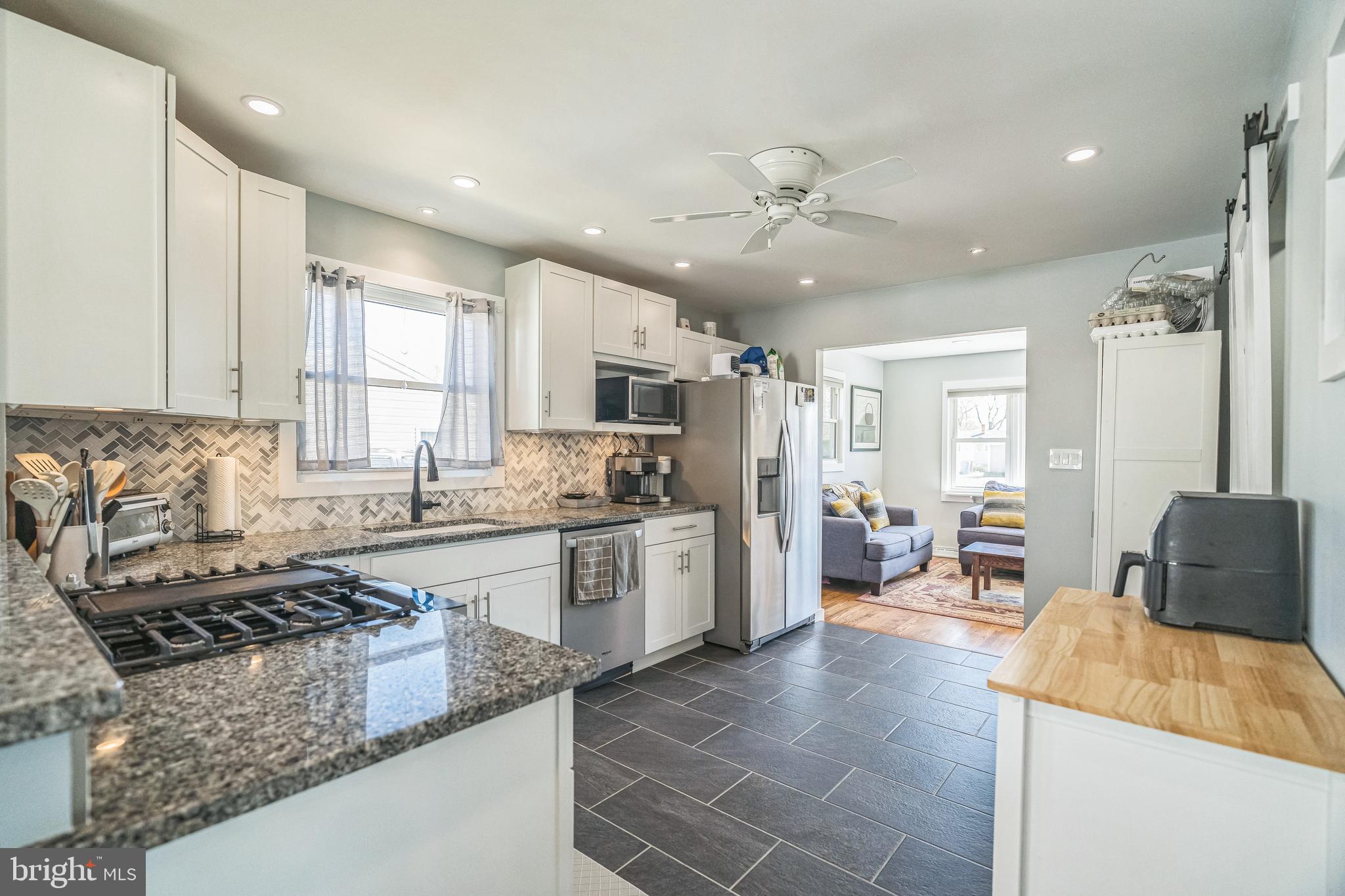 17 Gladwyn Road Marlton, NJ 08053 - Photo 10 of 34 a large kitchen with stainless steel appliances granite countertop a stove and a sink