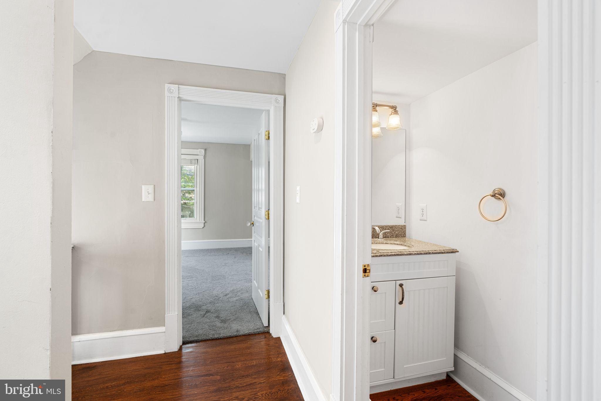 47 Estaugh Avenue Haddonfield, NJ 08033 - Photo 11 of 19 a view of a bathroom from a hallway