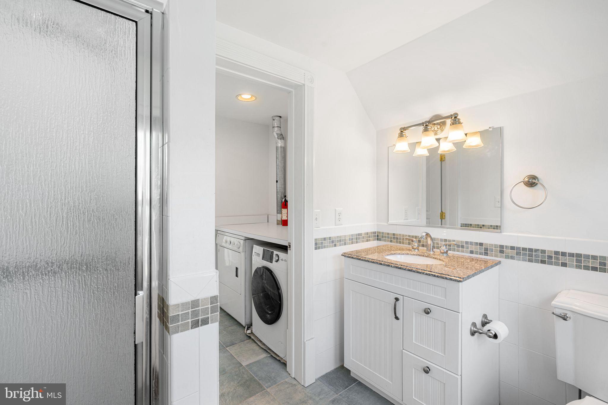 47 Estaugh Avenue Haddonfield, NJ 08033 - Photo 14 of 19 a spacious bathroom with a sink and a mirror