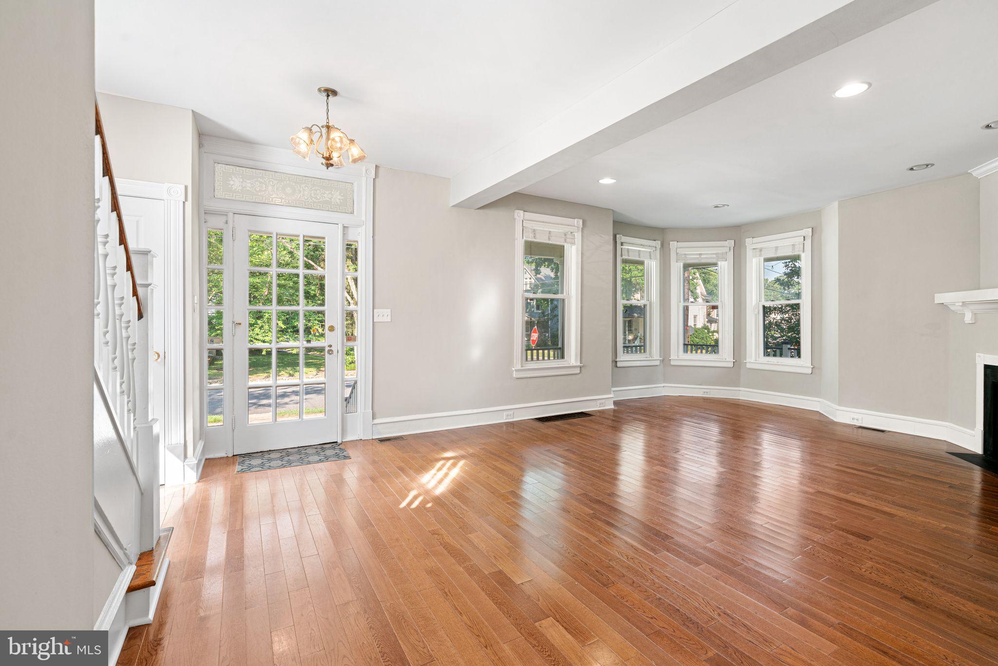 47 Estaugh Avenue Haddonfield, NJ 08033 - Photo 4 of 19 an empty room with wooden floor and windows