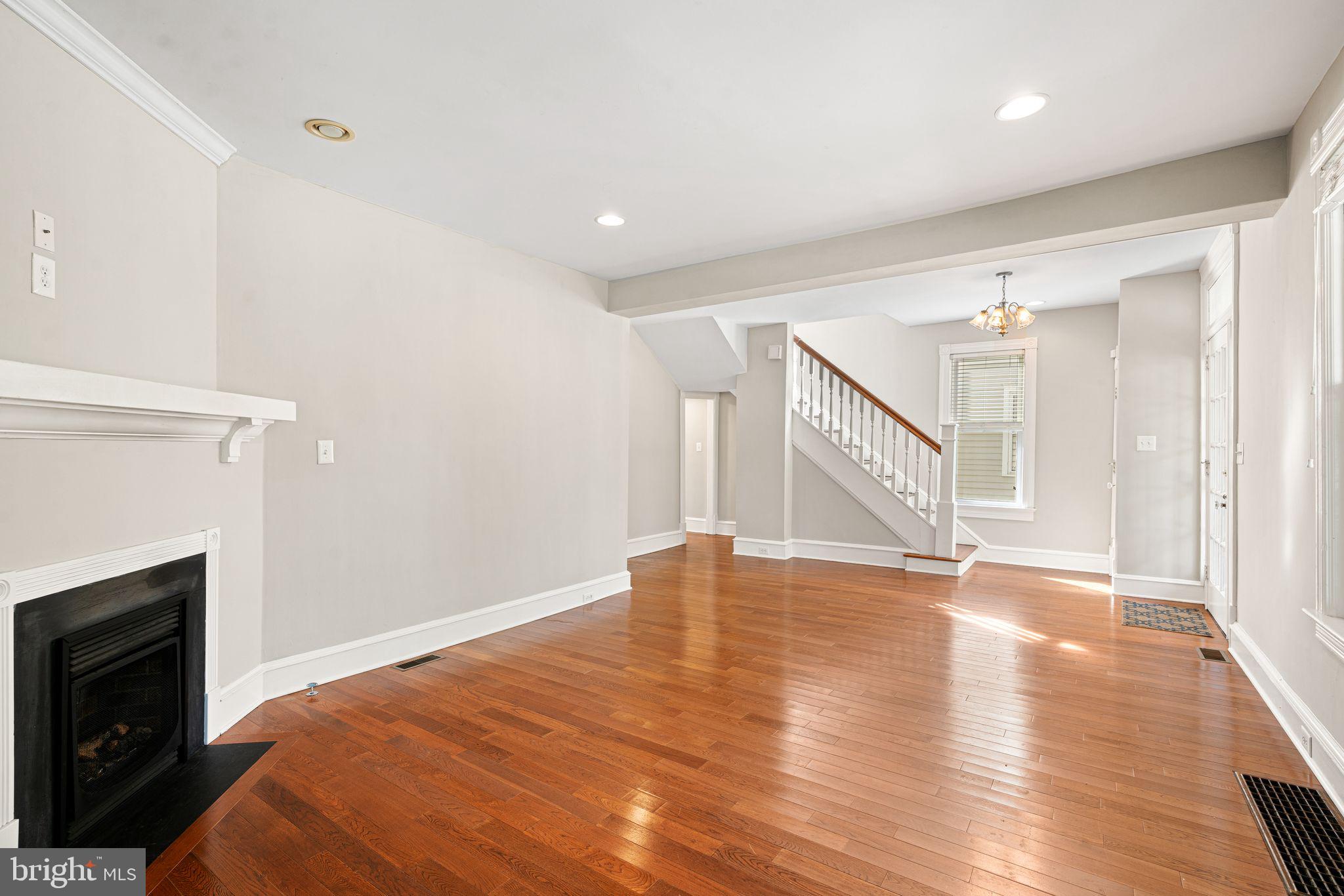 47 Estaugh Avenue Haddonfield, NJ 08033 - Photo 5 of 19 a view of an empty room with wooden floor fireplace and a window