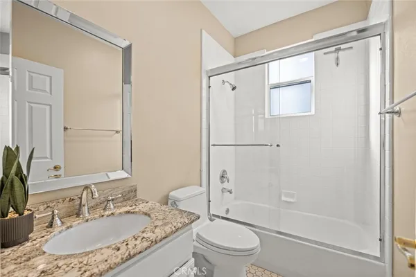 a view of a room with gym equipment and windows