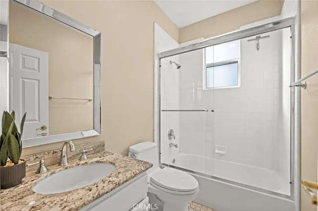 a view of a room with gym equipment and windows