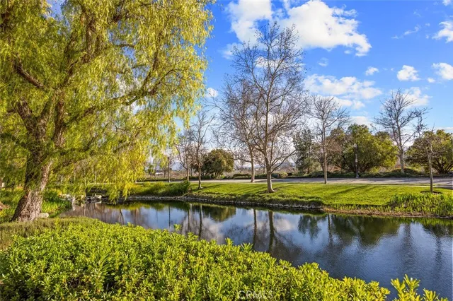 a view of a house with backyard porch and sitting area