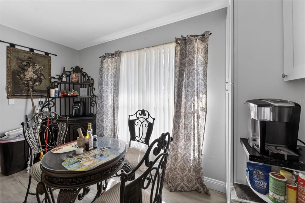 4154 16th Street East, Unit 15 Ellenton, FL 34222 - Photo 16 of 31 a view of a dining room with furniture and a window