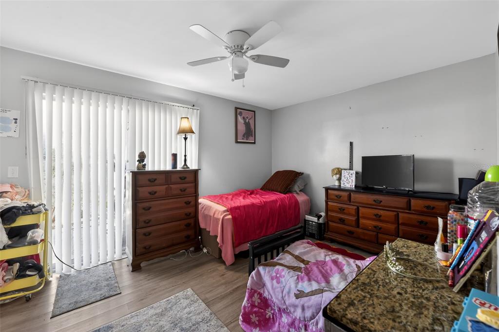 4154 16th Street East, Unit 15 Ellenton, FL 34222 - Photo 17 of 31 a bedroom with bed and a flat screen tv