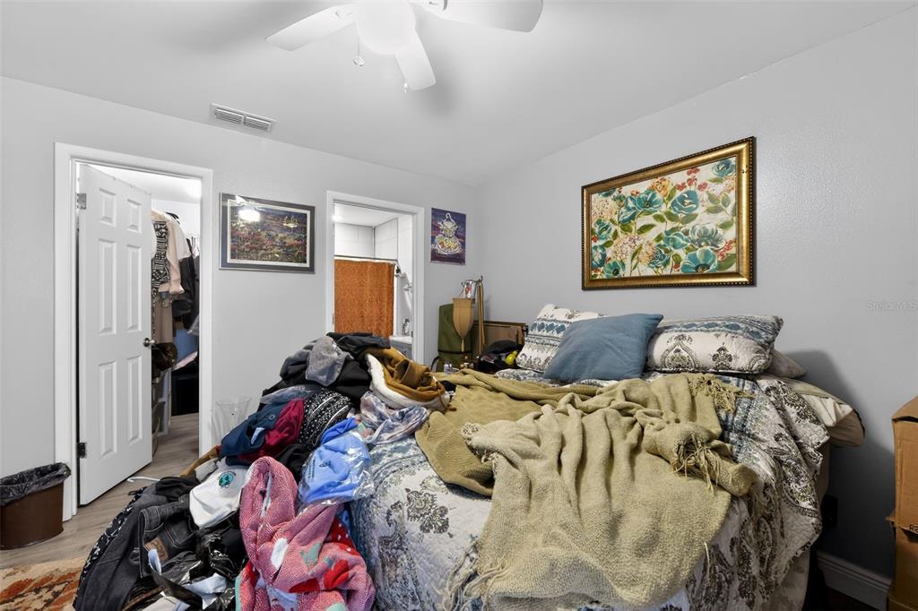 4154 16th Street East, Unit 15 Ellenton, FL 34222 - Photo 24 of 31 a bed room with two bed and a painting on the wall