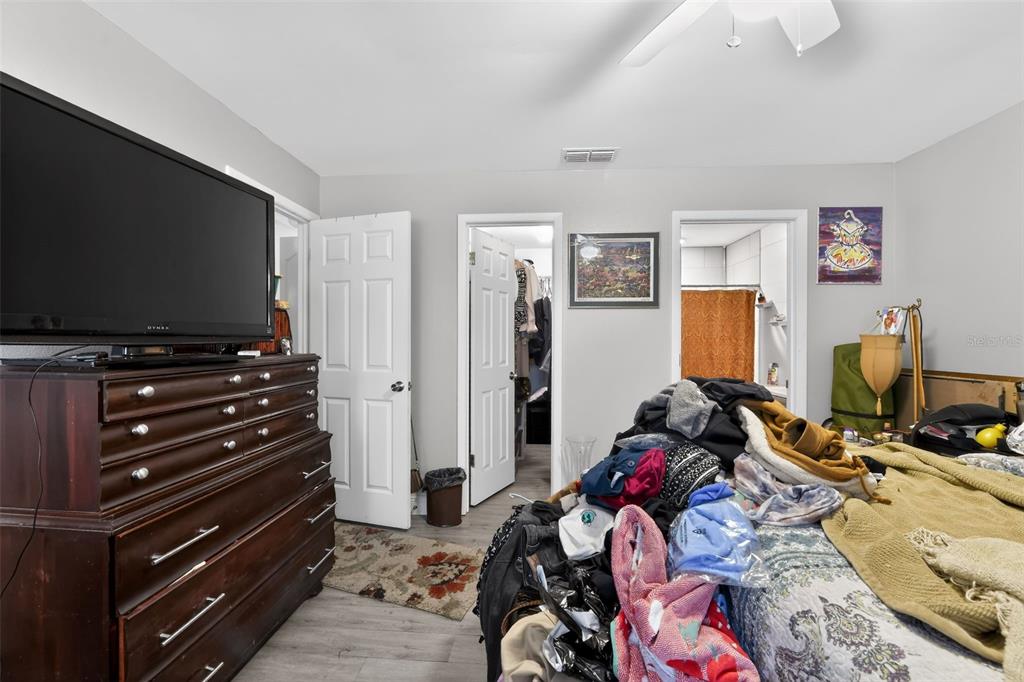 4154 16th Street East, Unit 15 Ellenton, FL 34222 - Photo 25 of 31 a bedroom with a bed and flat screen tv