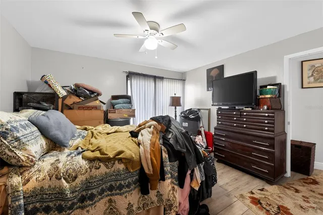 a bed room with bed and a flat screen tv