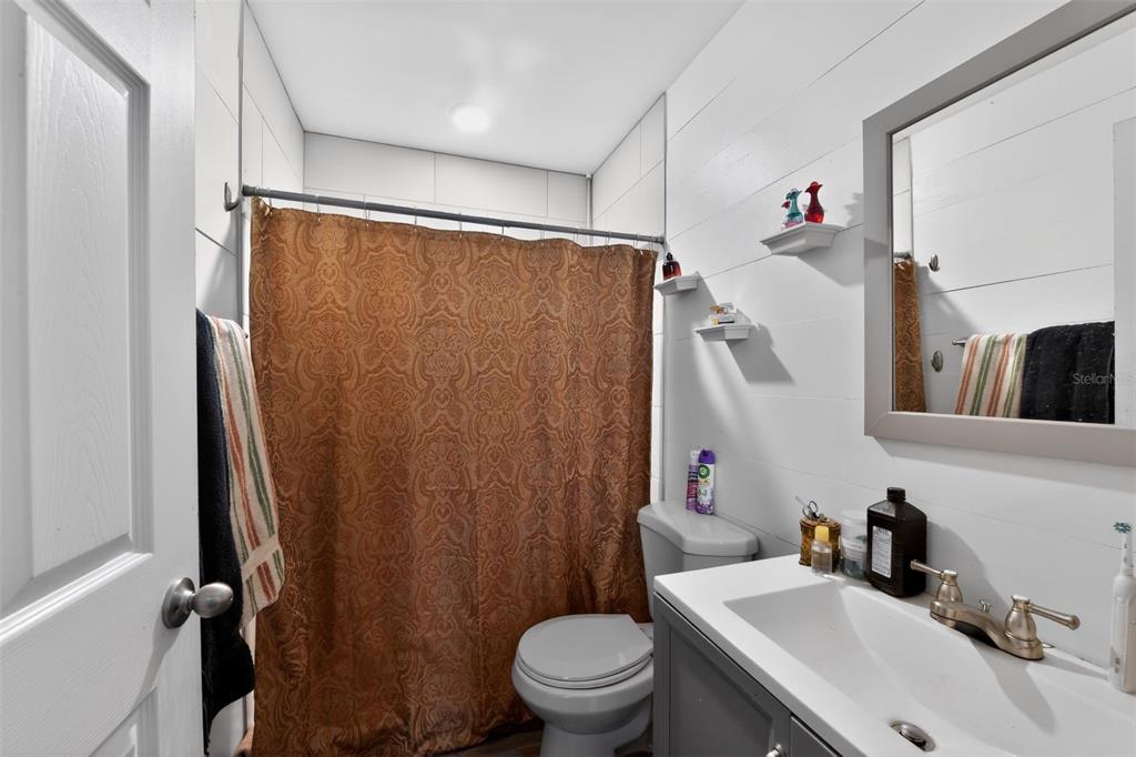 4154 16th Street East, Unit 15 Ellenton, FL 34222 - Photo 28 of 31 a bathroom with a sink toilet and shower