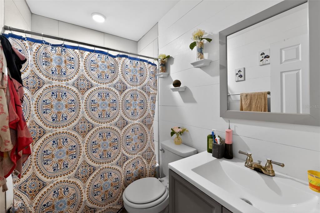 4154 16th Street East, Unit 15 Ellenton, FL 34222 - Photo 29 of 31 a bathroom with a sink toilet and shower