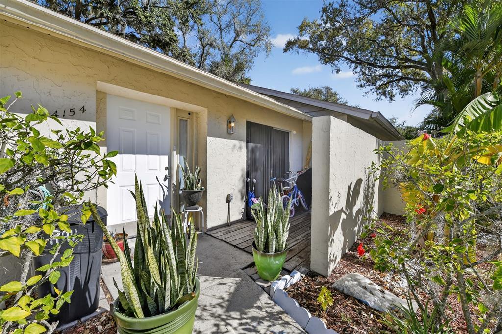 4154 16th Street East, Unit 15 Ellenton, FL 34222 - Photo 3 of 31 a view of a potted plants in front of a door