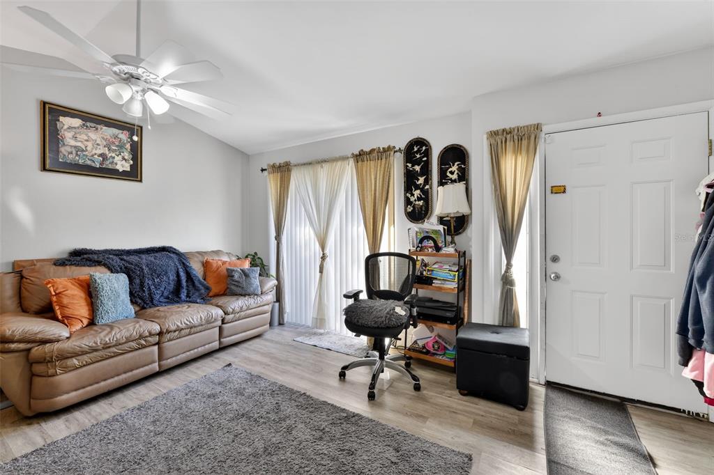 4154 16th Street East, Unit 15 Ellenton, FL 34222 - Photo 6 of 31 a living room with furniture and a window