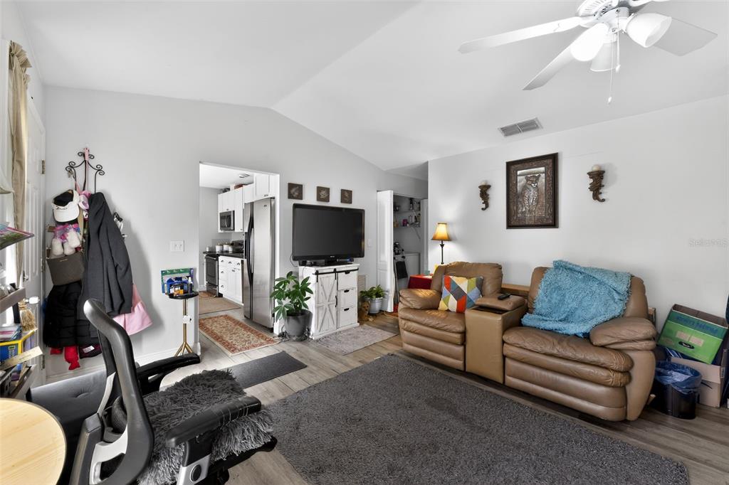4154 16th Street East, Unit 15 Ellenton, FL 34222 - Photo 7 of 31 a living room with furniture and a flat screen tv