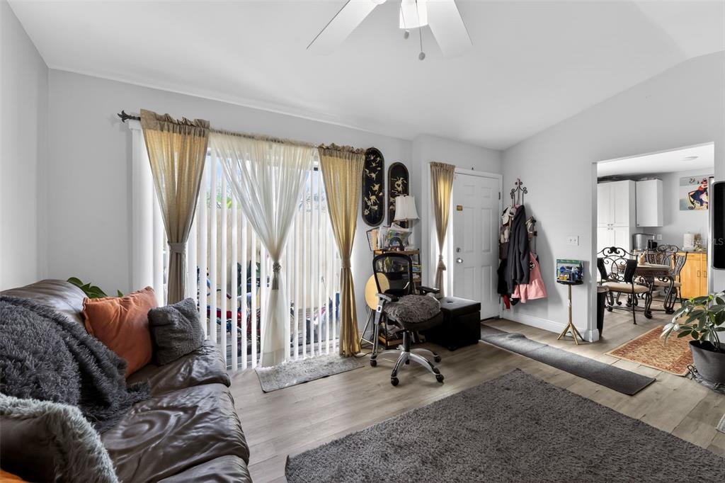4154 16th Street East, Unit 15 Ellenton, FL 34222 - Photo 8 of 31 a living room with furniture a rug and a large window
