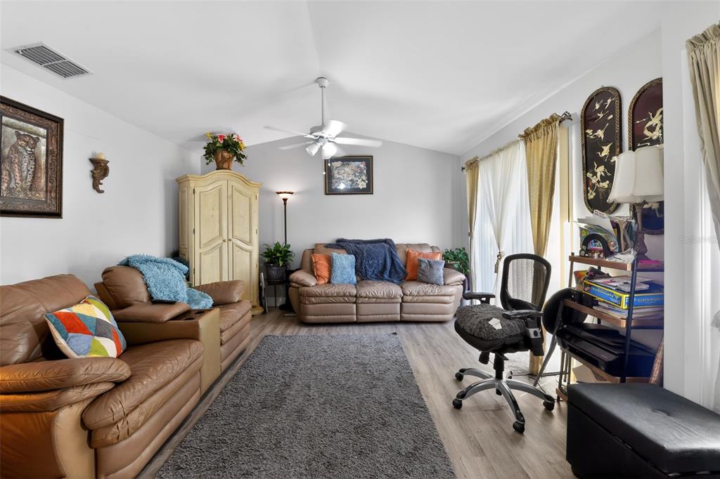 4154 16th Street East, Unit 15 Ellenton, FL 34222 - Photo 9 of 31 a living room with furniture a rug and a window