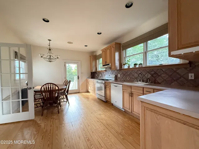 a view of a dining area with furniture window and wooden floor