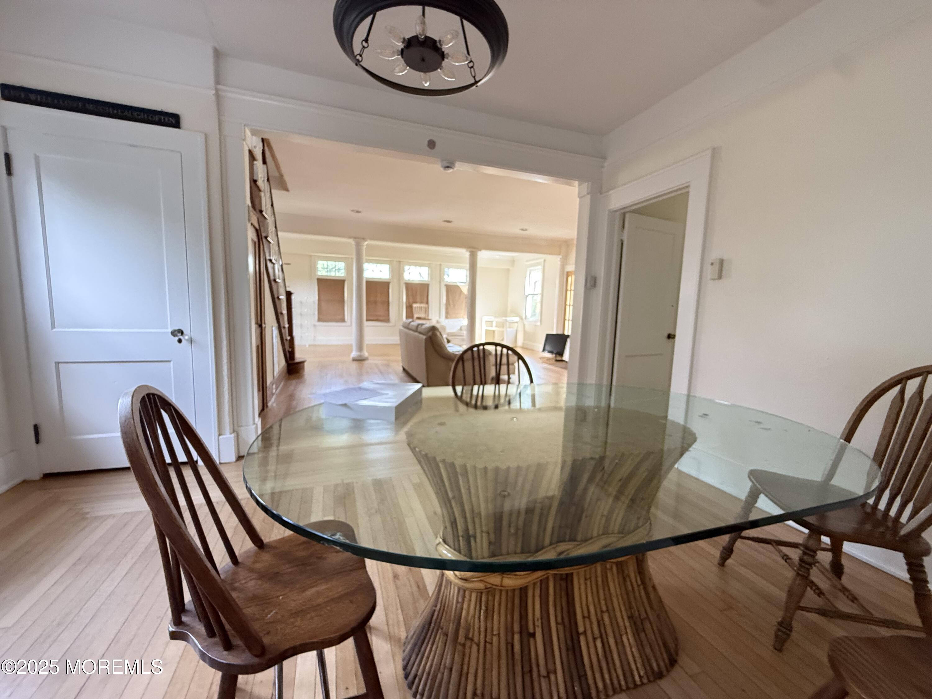 210 Lincoln Avenue, Unit WINTER 25 Long Branch, NJ 07740 - Photo 17 of 38 a view of a dining room with furniture and wooden floor