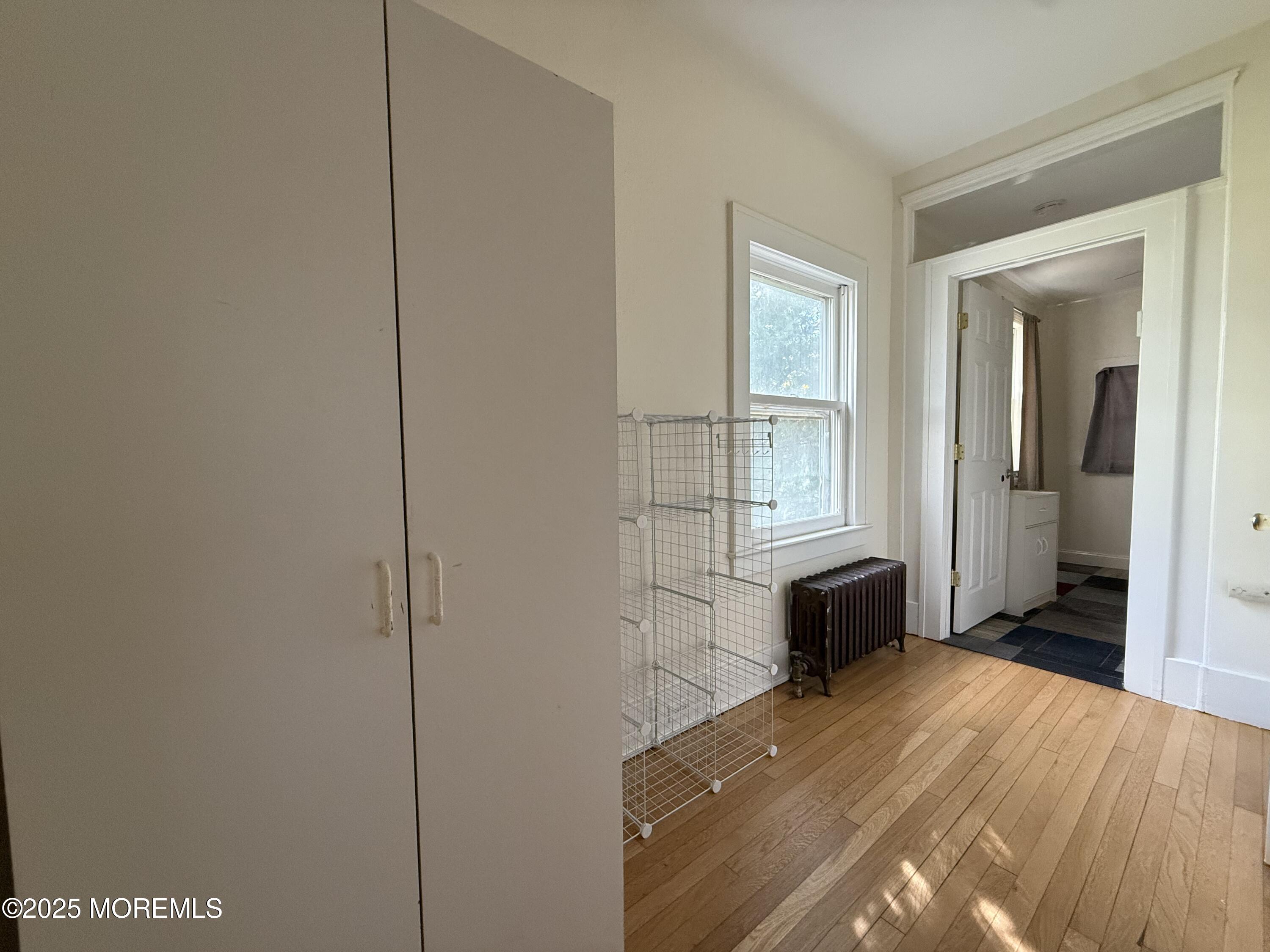 210 Lincoln Avenue, Unit WINTER 25 Long Branch, NJ 07740 - Photo 18 of 38 a bedroom with a bed and a window