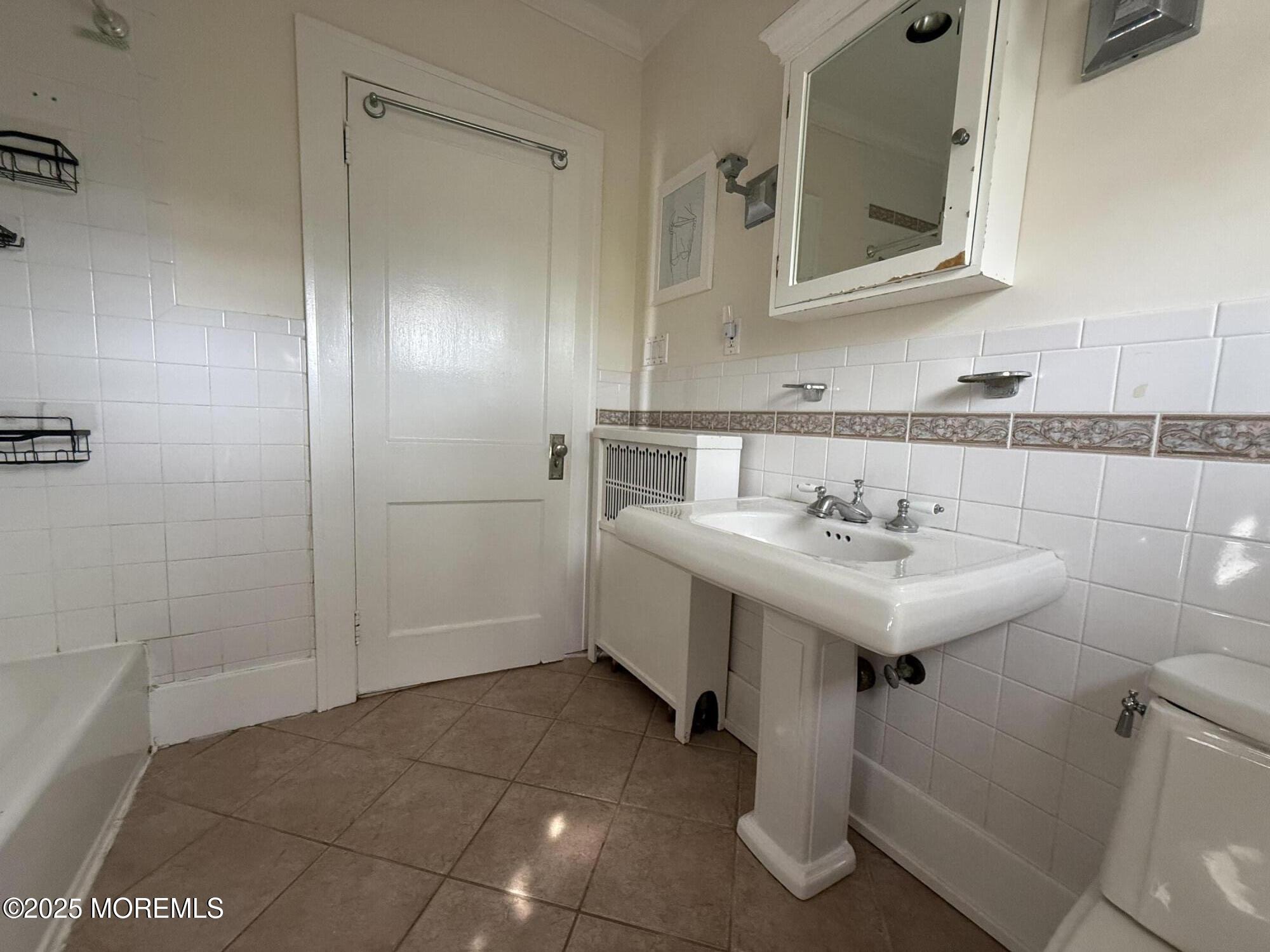210 Lincoln Avenue, Unit WINTER 25 Long Branch, NJ 07740 - Photo 21 of 38 a bathroom with a sink and a mirror