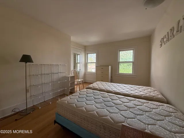 a room with pool table and windows