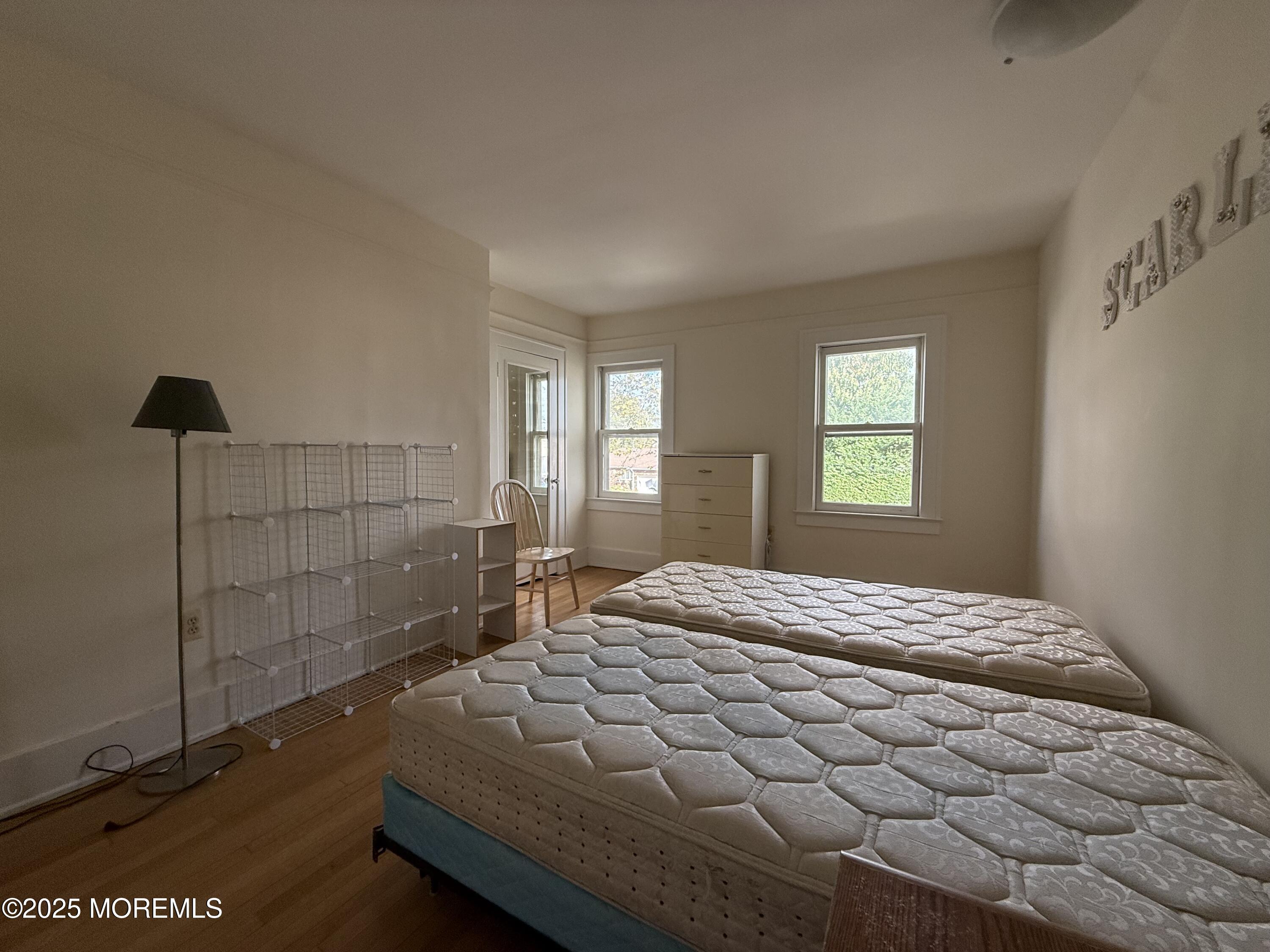 210 Lincoln Avenue, Unit WINTER 25 Long Branch, NJ 07740 - Photo 22 of 38 a bedroom with a bed and window