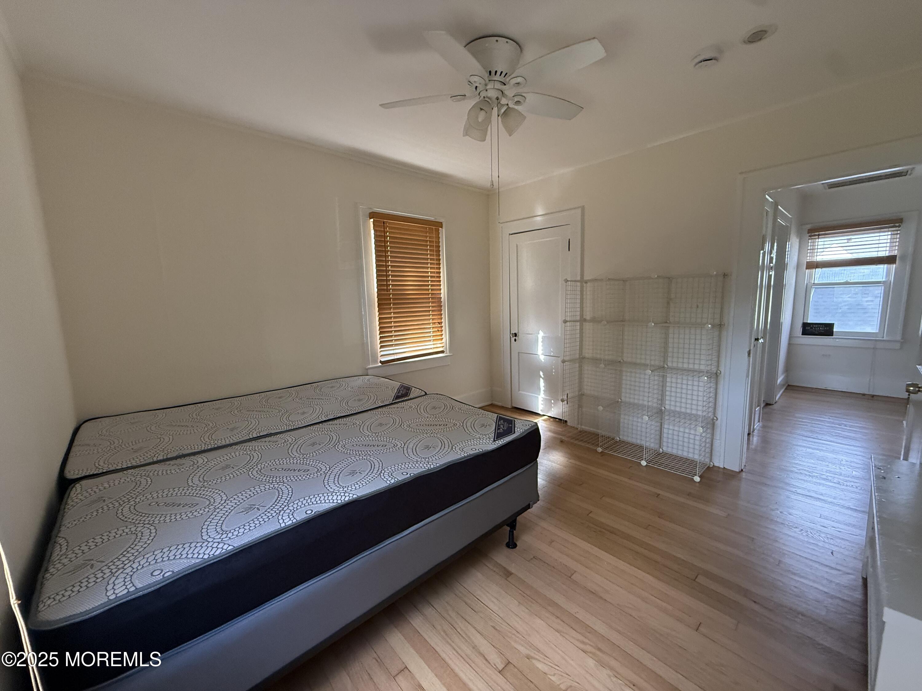 210 Lincoln Avenue, Unit WINTER 25 Long Branch, NJ 07740 - Photo 24 of 38 a spacious bedroom with a bed and a window