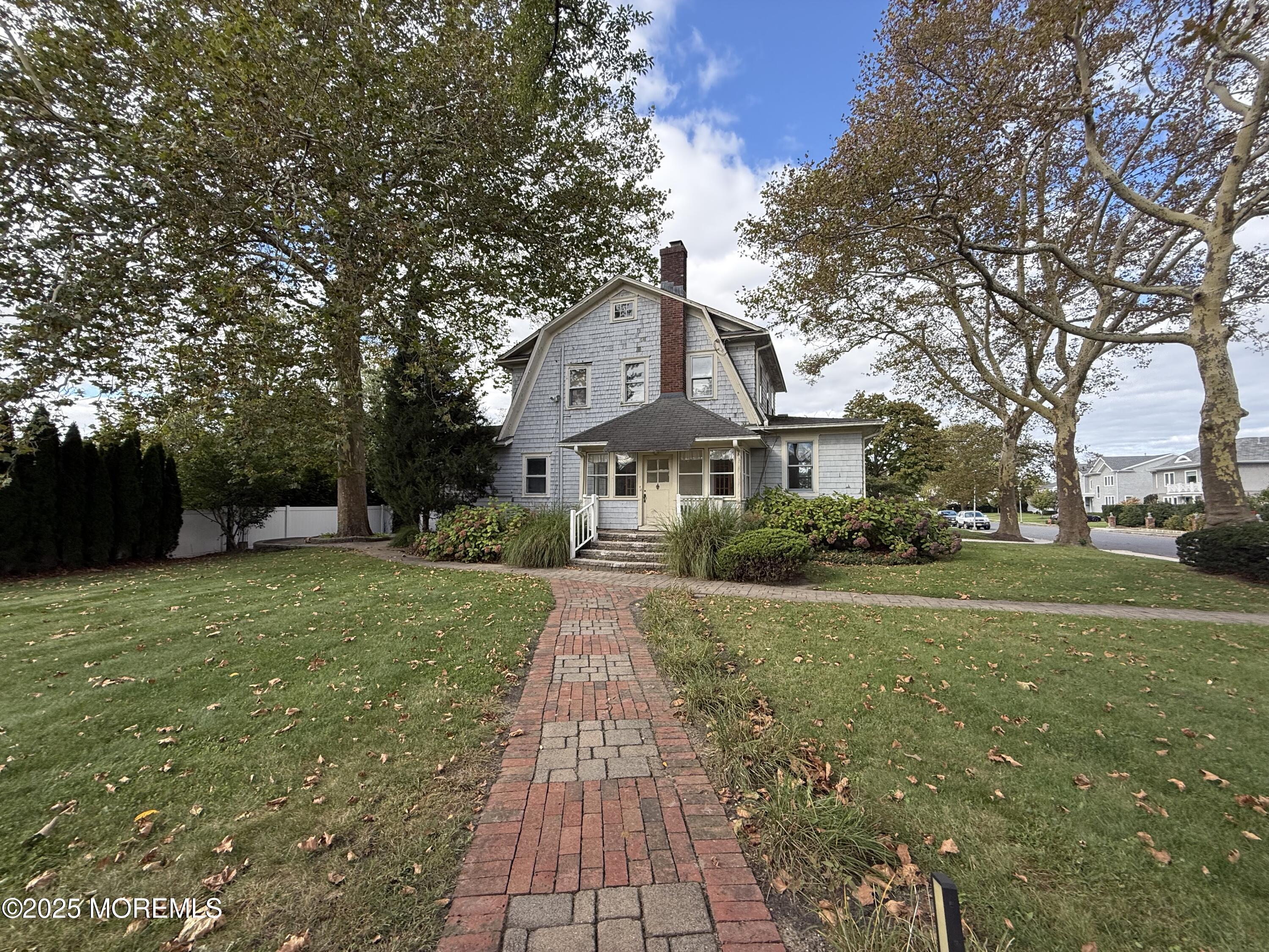 210 Lincoln Avenue, Unit WINTER 25 Long Branch, NJ 07740 - Photo 27 of 38 a front view of a house with yard and green space