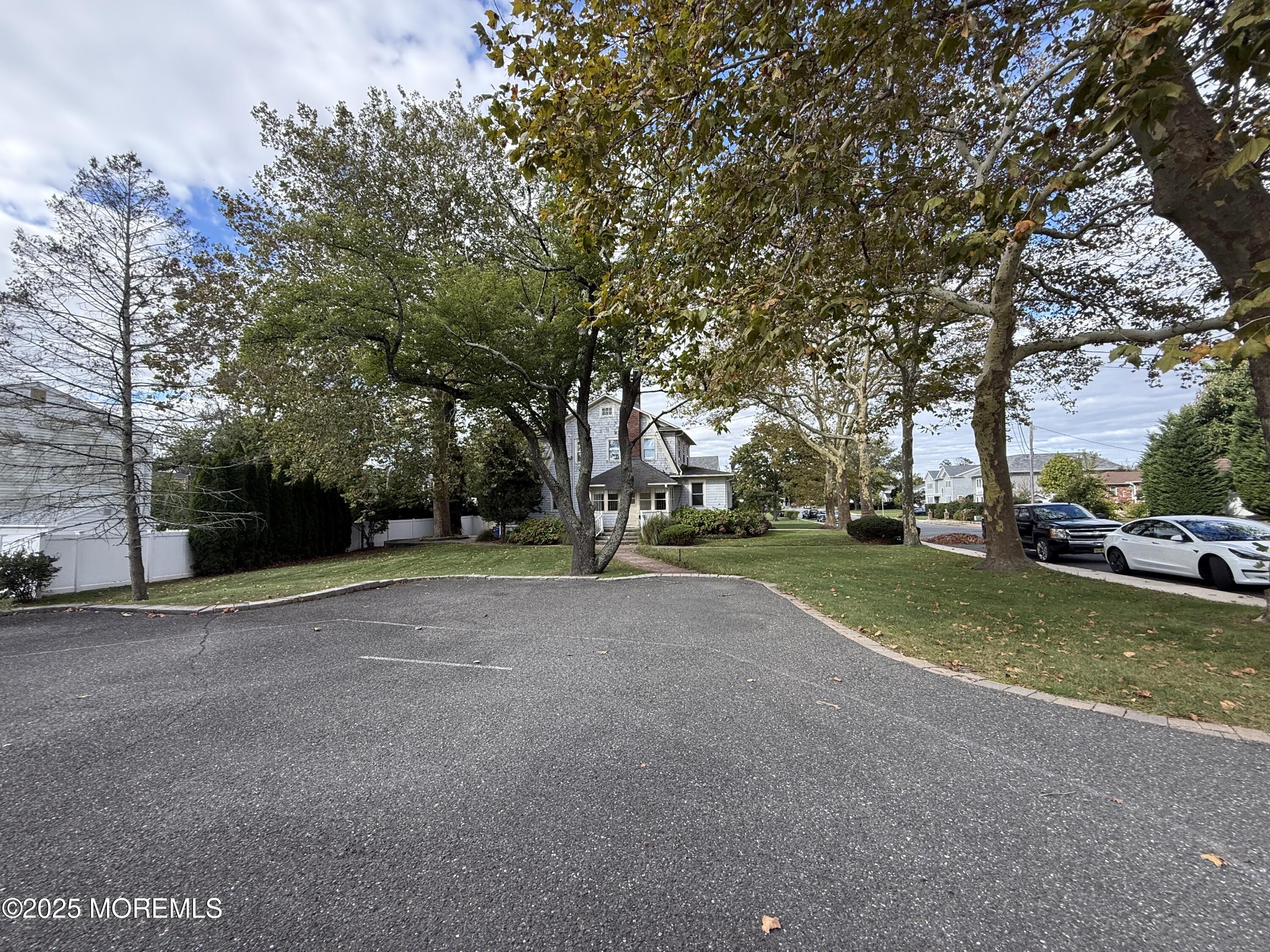 210 Lincoln Avenue, Unit WINTER 25 Long Branch, NJ 07740 - Photo 29 of 38 a view of a house with a yard and garage