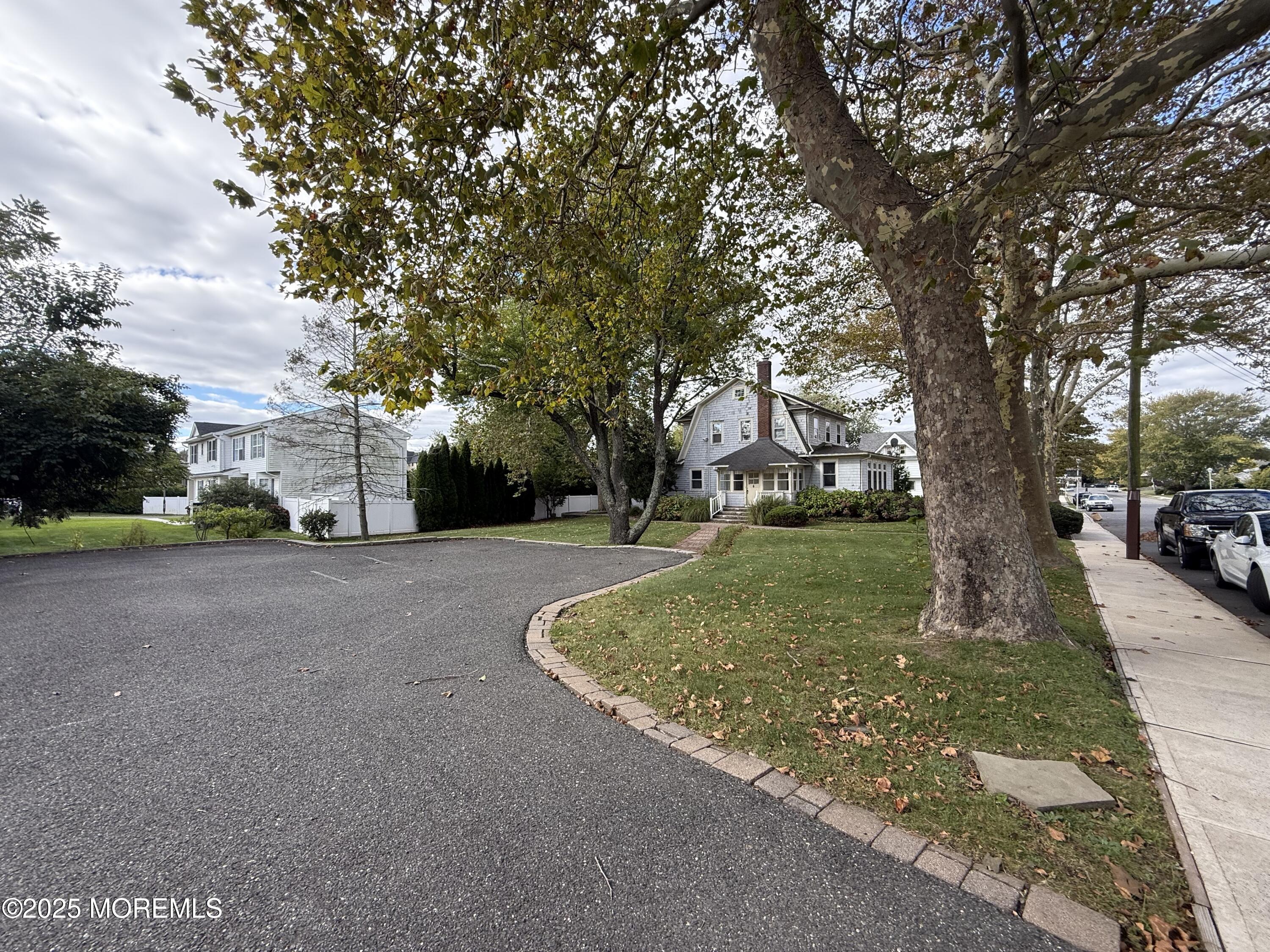 210 Lincoln Avenue, Unit WINTER 25 Long Branch, NJ 07740 - Photo 30 of 38 a view of outdoor space with garden
