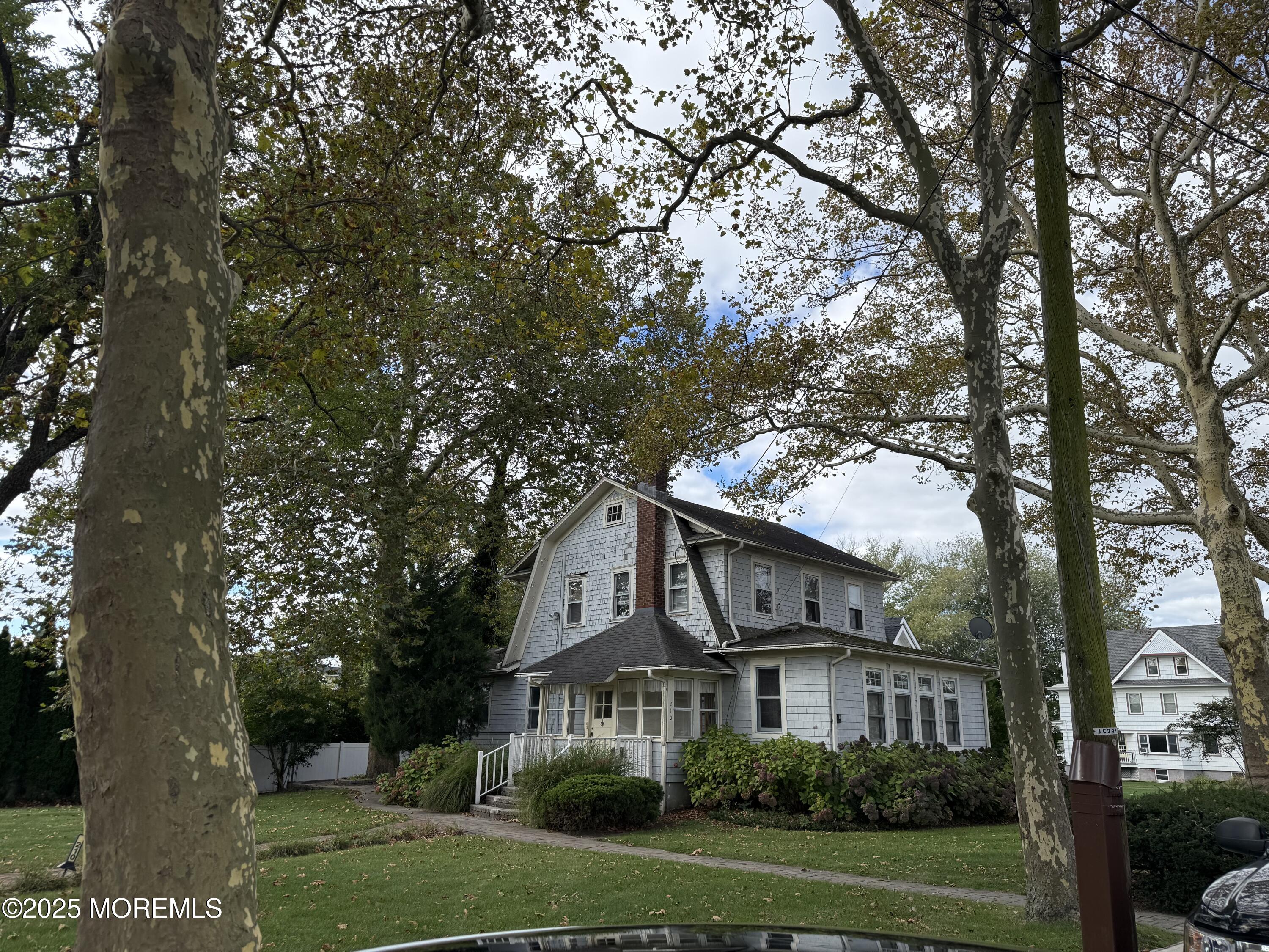 210 Lincoln Avenue, Unit WINTER 25 Long Branch, NJ 07740 - Photo 33 of 38 a front view of a house with a garden