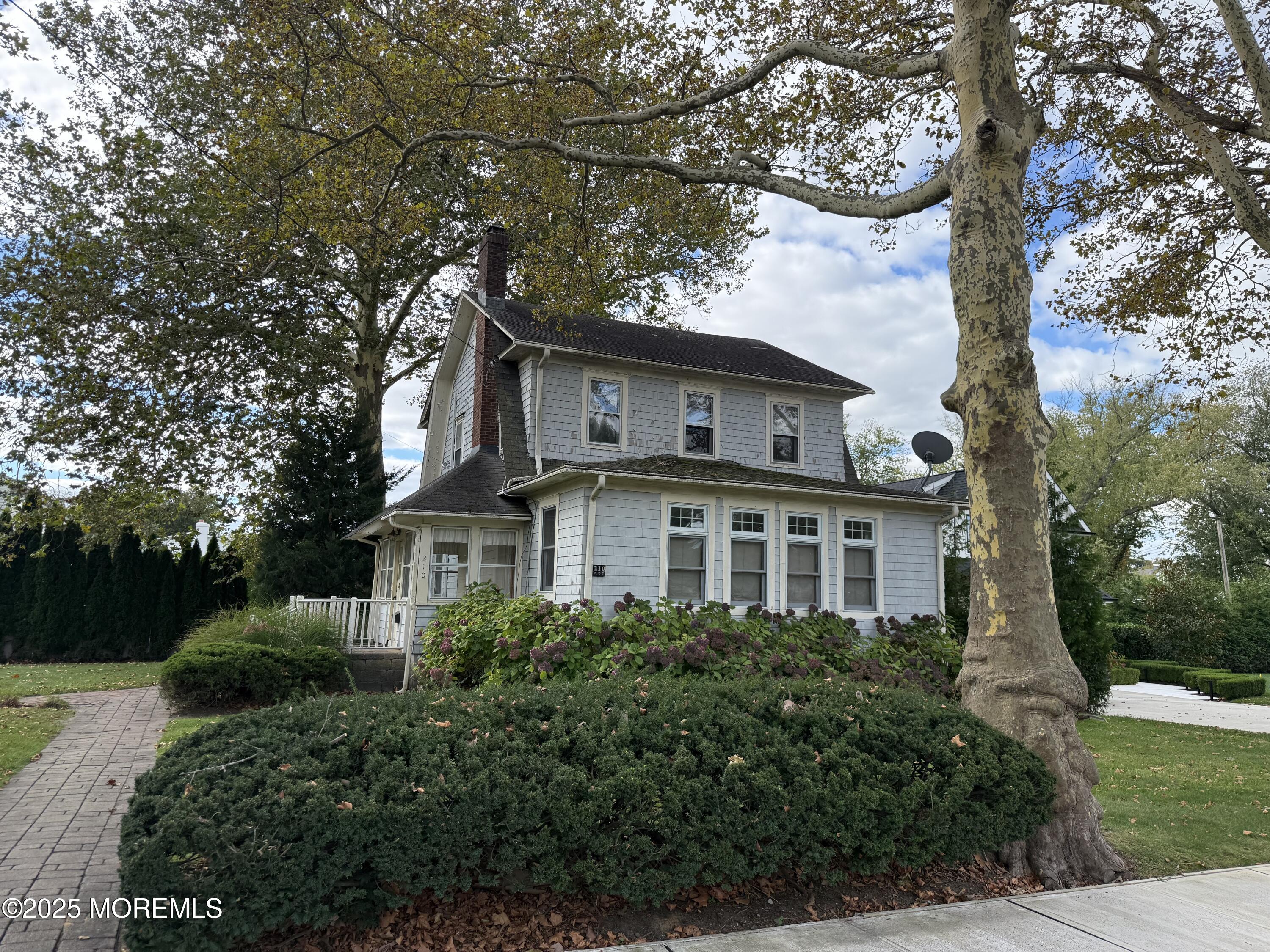 210 Lincoln Avenue, Unit WINTER 25 Long Branch, NJ 07740 - Photo 34 of 38 a front view of a house with a garden