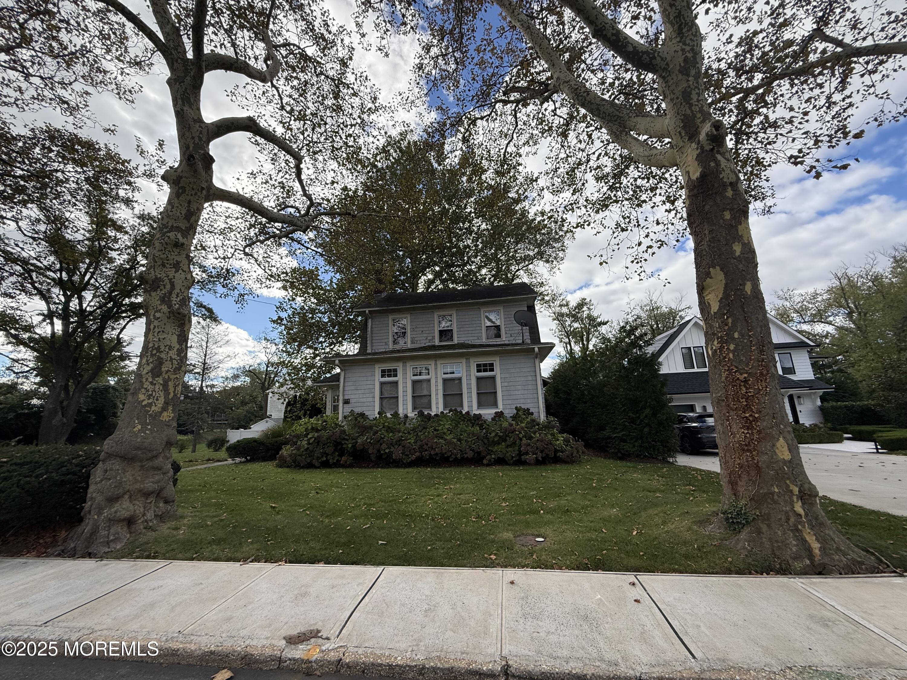 210 Lincoln Avenue, Unit WINTER 25 Long Branch, NJ 07740 - Photo 35 of 38 a front view of a house with a garden