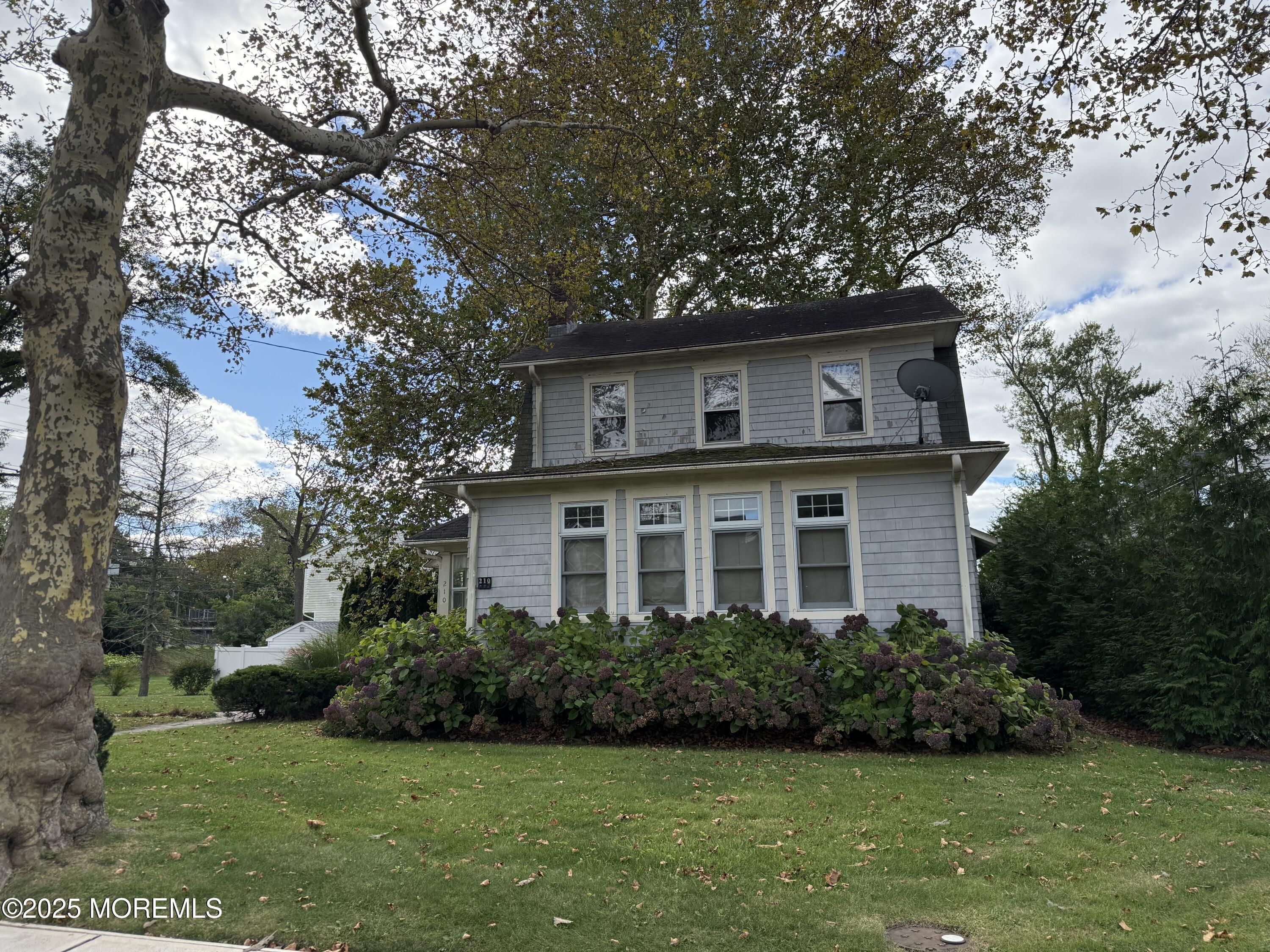 210 Lincoln Avenue, Unit WINTER 25 Long Branch, NJ 07740 - Photo 36 of 38 a front view of a house with a yard