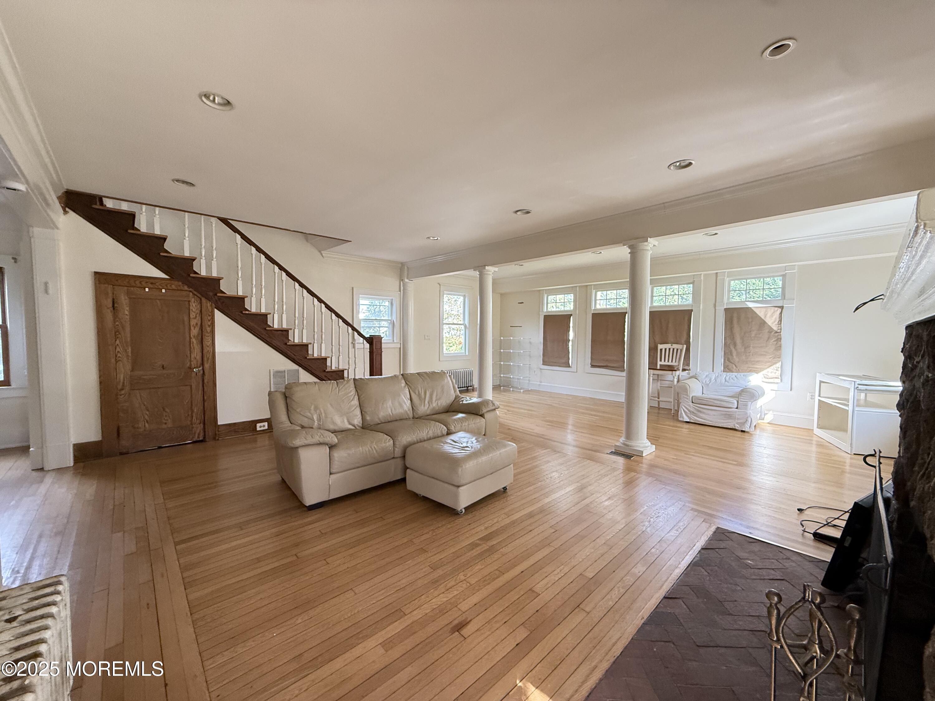210 Lincoln Avenue, Unit WINTER 25 Long Branch, NJ 07740 - Photo 8 of 38 a living room with furniture and wooden floor