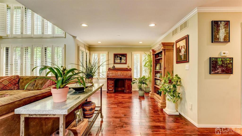 449 Sayre Drive Plainsboro, NJ 08540 - Photo 14 of 58 a living room with fireplace furniture and a potted plant
