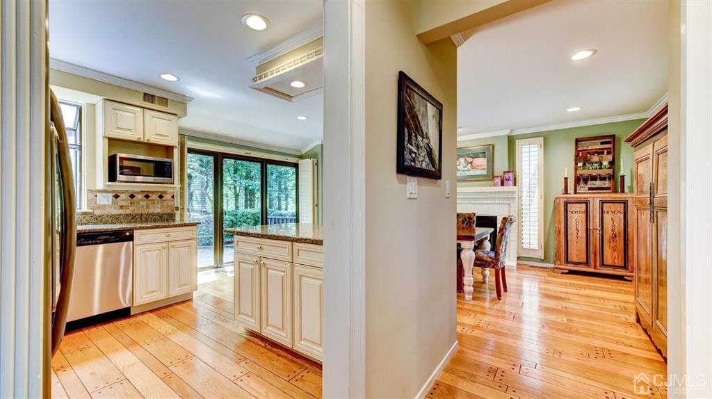449 Sayre Drive Plainsboro, NJ 08540 - Photo 18 of 58 a view of a living room with furniture and flat screen tv
