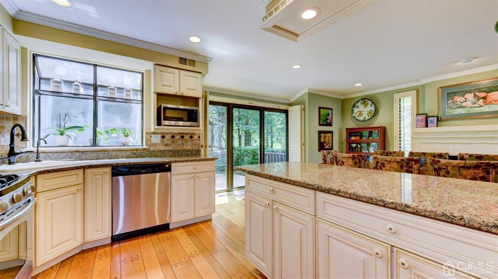 449 Sayre Drive Plainsboro, NJ 08540 - Photo 19 of 58 a large kitchen with granite countertop a large window and a sink