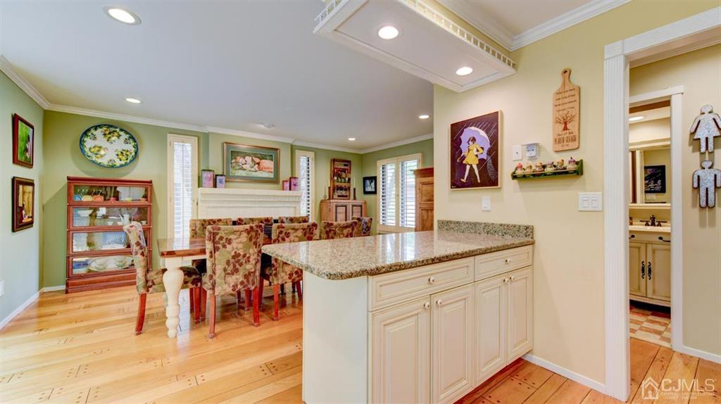 449 Sayre Drive Plainsboro, NJ 08540 - Photo 23 of 58 a kitchen with stainless steel appliances granite countertop a dining table chairs cabinets and a window
