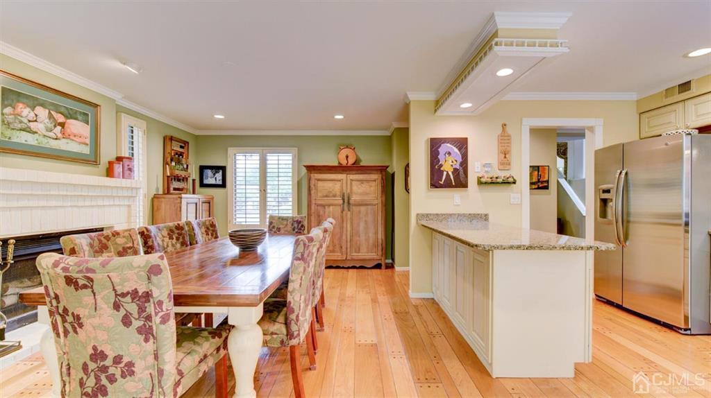 449 Sayre Drive Plainsboro, NJ 08540 - Photo 26 of 58 a kitchen with stainless steel appliances kitchen island granite countertop furniture and a refrigerator