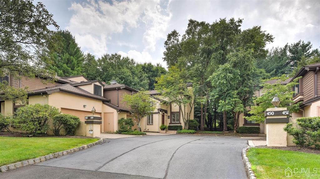 449 Sayre Drive Plainsboro, NJ 08540 - Photo 3 of 58 a front view of a house with a garden and trees