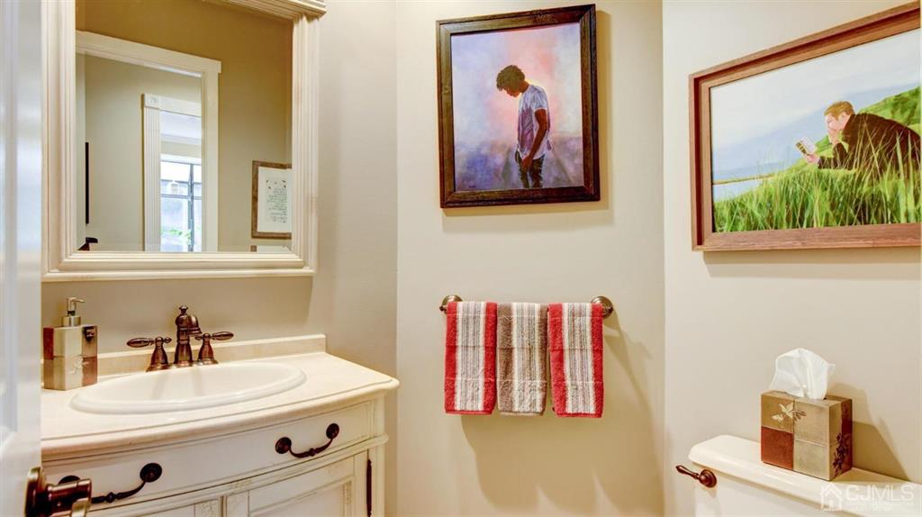 449 Sayre Drive Plainsboro, NJ 08540 - Photo 32 of 58 a bathroom with a sink and a mirror