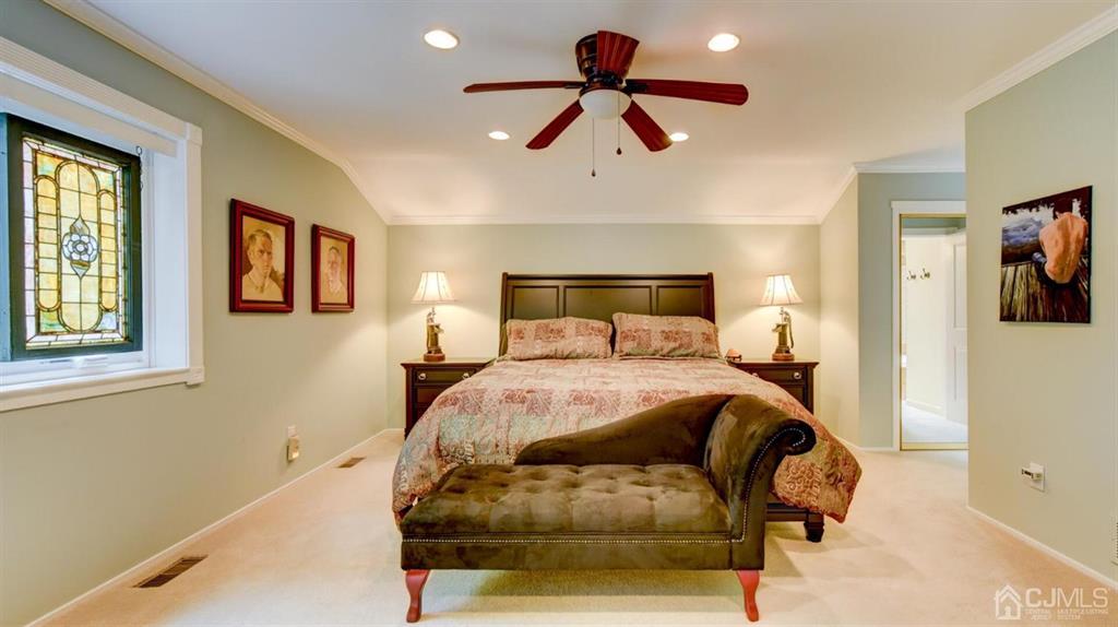 449 Sayre Drive Plainsboro, NJ 08540 - Photo 36 of 58 a bedroom with a bed and wooden floor