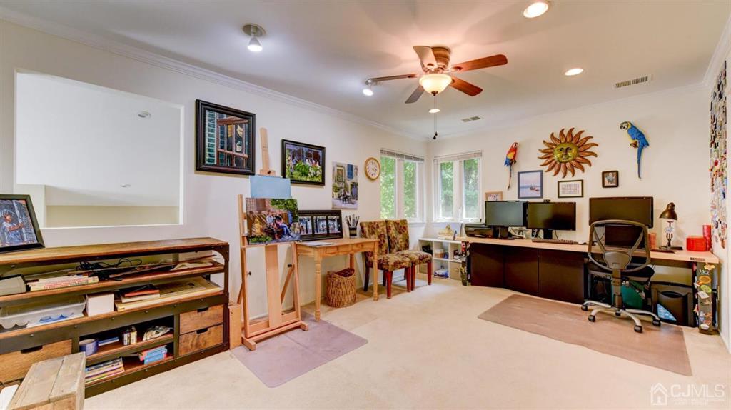 449 Sayre Drive Plainsboro, NJ 08540 - Photo 42 of 58 a view of a workspace with furniture and a ceiling fan