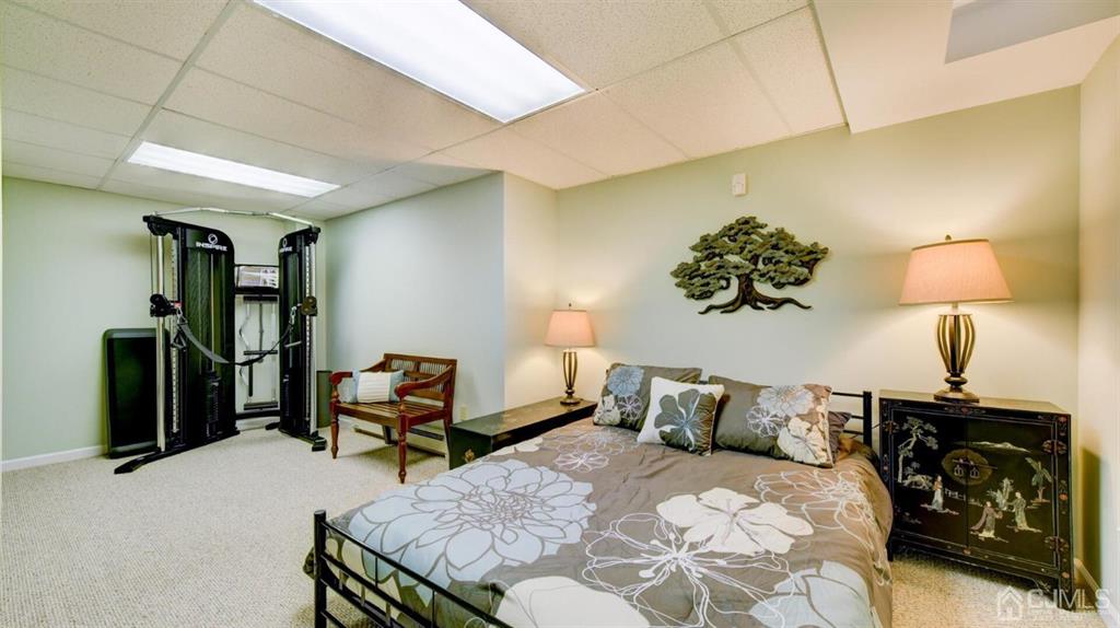 449 Sayre Drive Plainsboro, NJ 08540 - Photo 52 of 58 a bedroom with a bed and a lamp on table