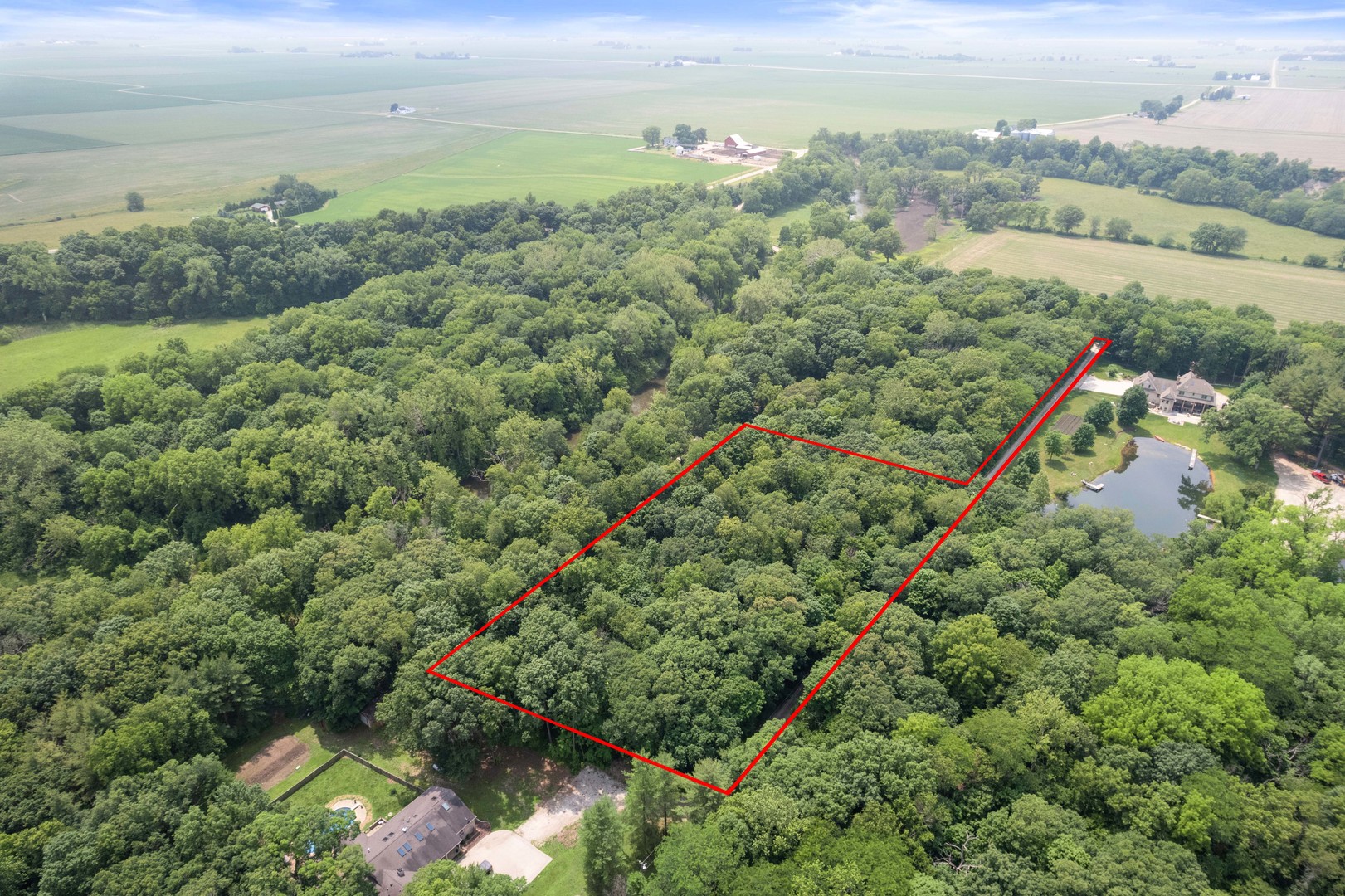 4006 East 1950th Road Sheridan, IL 60551 - Photo 17 of 26 an aerial view of green landscape with trees houses and lake view